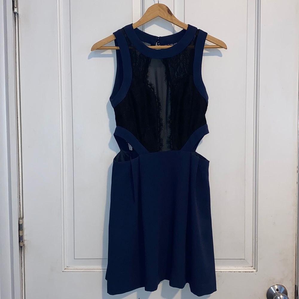Navy blue BCBGeneration dress with black lace and cut out back.